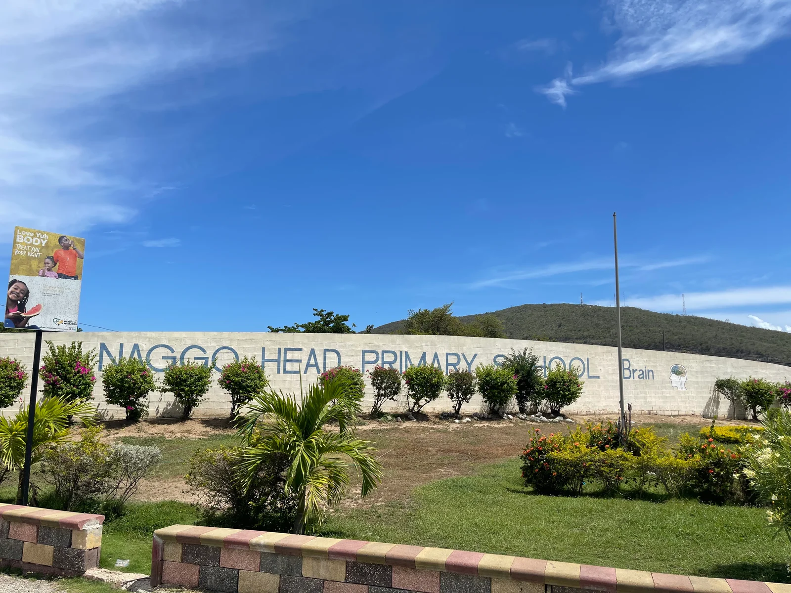 School exterior with Naggo Head Primary signage.